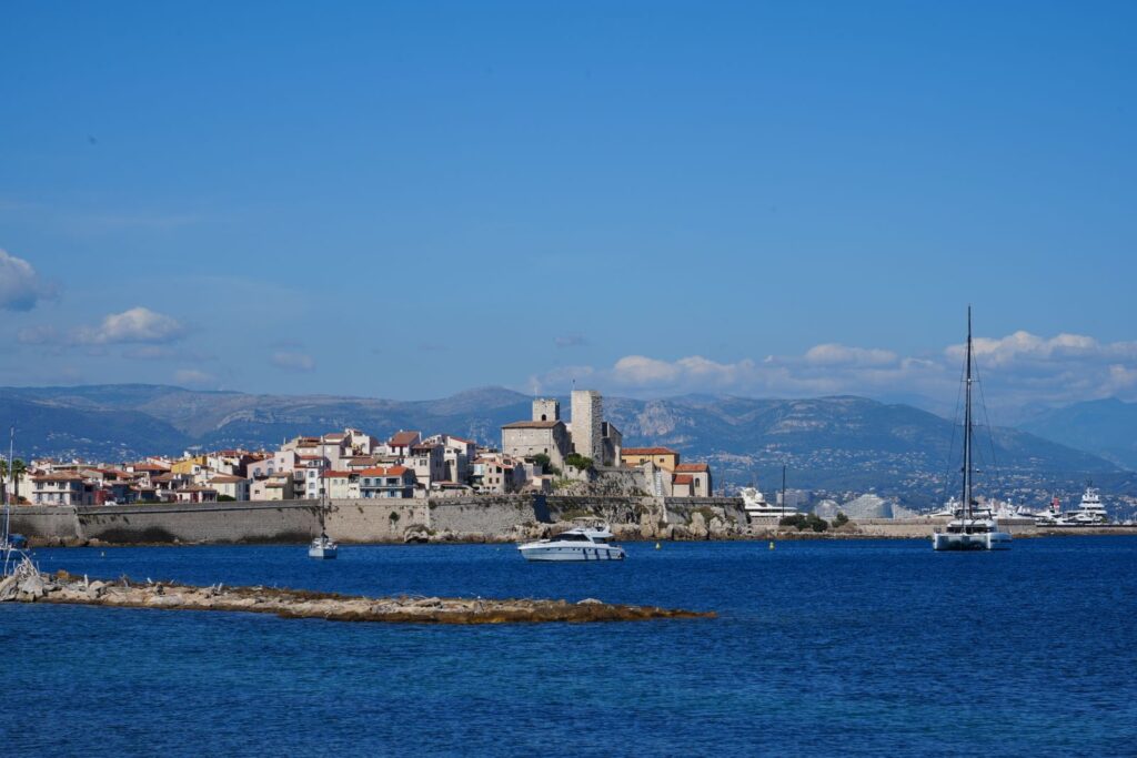 Antibes old town and marina under a blue sky