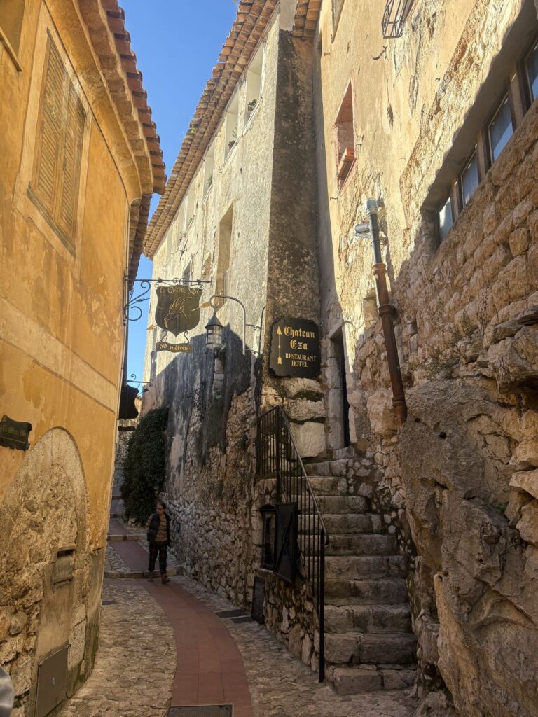 A narrow cobbled alley in the medieval heart of Eze Village